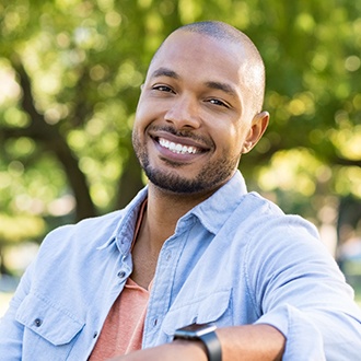 Man with flawless smile after adult orthodontics