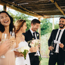 Wedding party smiling outside