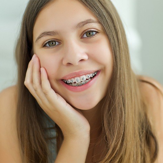 Teen girl with self-ligating braces smiling