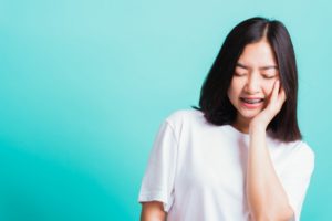 Girl with braces in Framingham dealing with mouth sores
