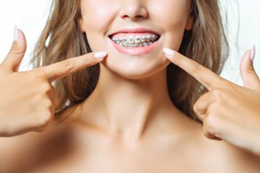 a patient closely inspecting their gums